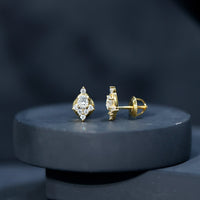 Rosec Jewels certified moissanite stud earrings in yellow gold plated silver, featuring sparkling gemstone and classic design.