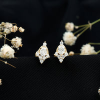 Rosec Jewels certified moissanite stud earrings in yellow gold plated silver, featuring sparkling gemstone and classic earring design.