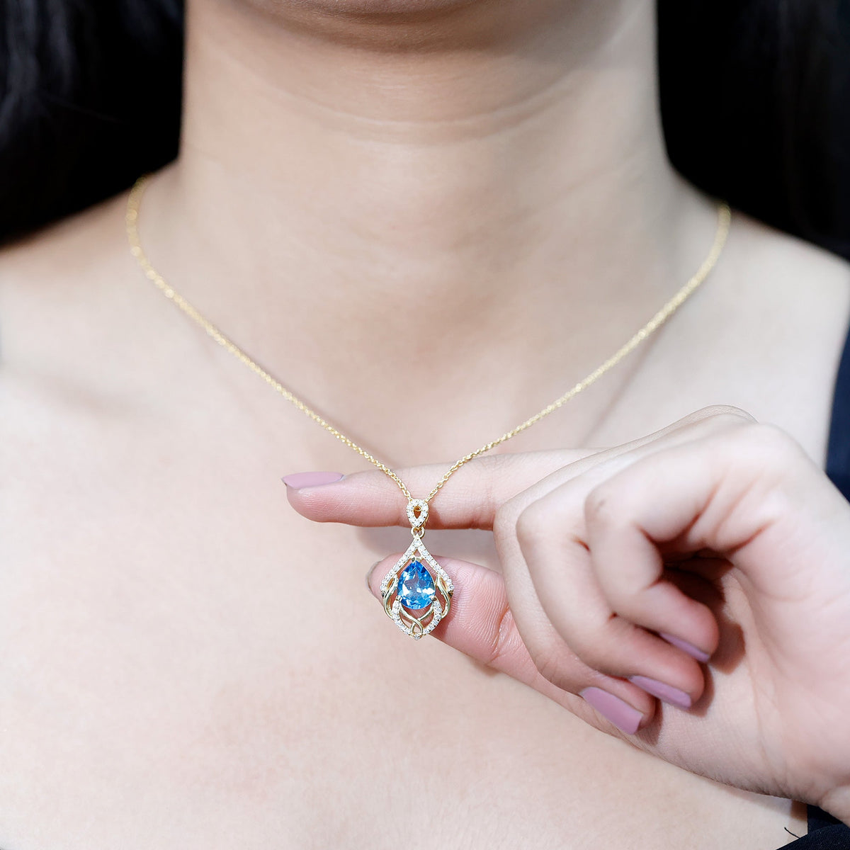 Elegant Swiss Blue Topaz pendant with lab diamond, designed wedding necklace by Rosec Jewels, showcasing intricate craftsmanship.