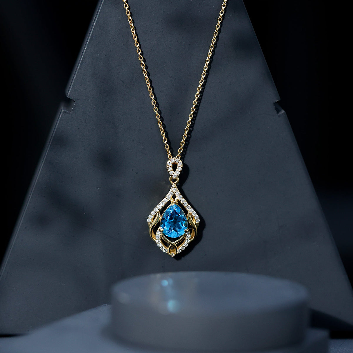 Elegant pendant necklace featuring a 2.2 carat Swiss Blue Topaz with lab diamond accents, designed by Rosec Jewels.