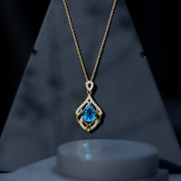 Elegant pendant necklace featuring a 2.2 carat Swiss Blue Topaz with lab diamond accents, designed by Rosec Jewels.