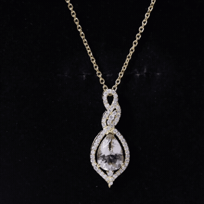 Yellow gold pendant featuring a 1.75 carat Morganite teardrop and diamond accents, crafted by Rosec Jewels.