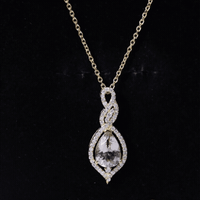 Yellow gold pendant featuring a 1.75 carat Morganite teardrop and diamond accents, crafted by Rosec Jewels.