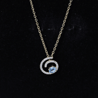 Genuine sky blue topaz and diamond swirl pendant necklace with silver chain from Rosec Jewels, showcasing a sparkling gemstone design.