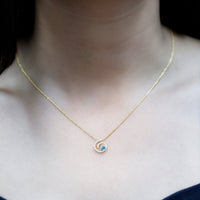 Genuine sky blue topaz and diamond swirl pendant necklace with silver chain from Rosec Jewels, showcasing sparkling gemstones and elegant design.