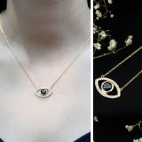 Natural 1.6 carat black diamond evil eye pendant in yellow gold plated silver, showcasing a detailed pendant with a protective evil eye design.