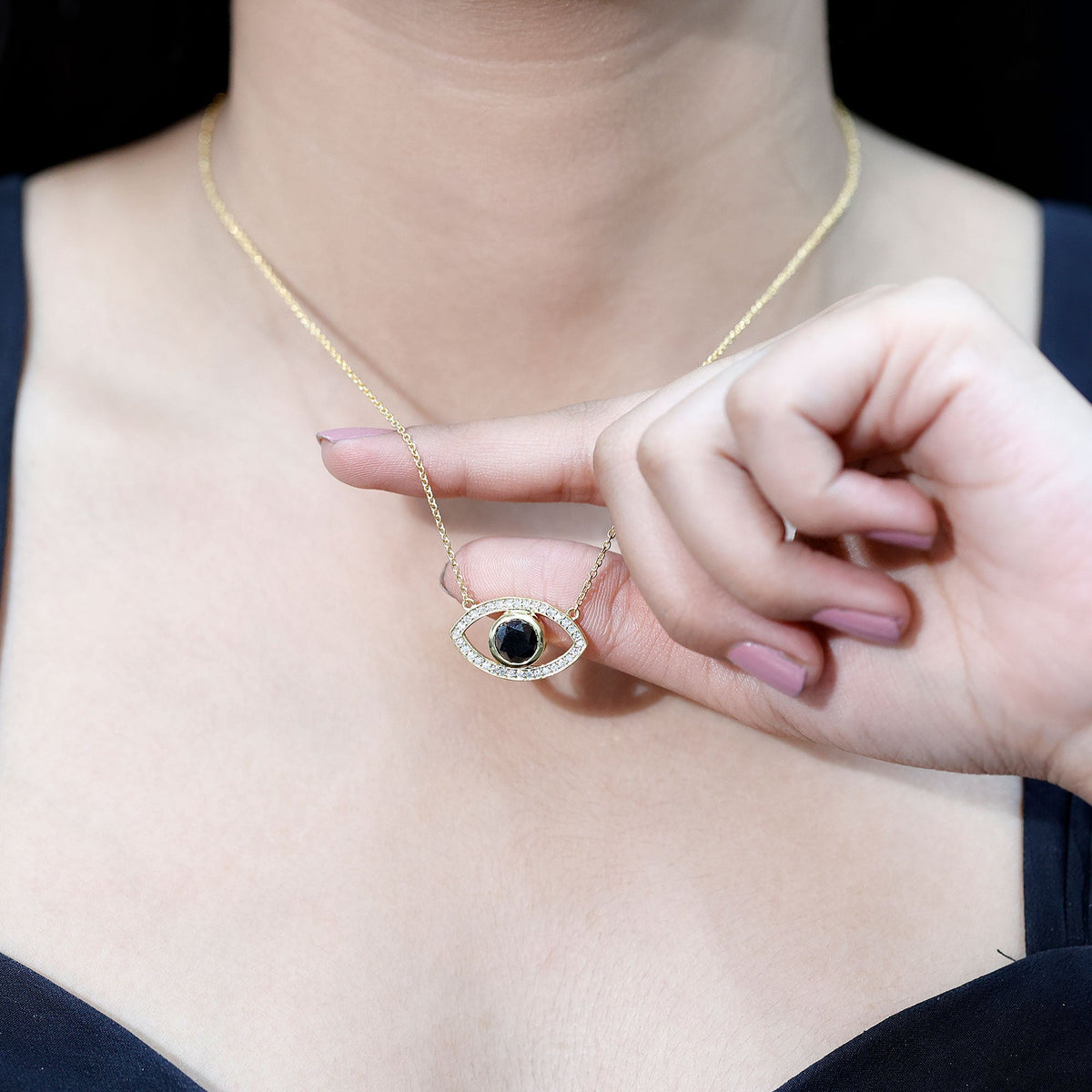 Yellow gold plated silver evil eye pendant with a 1.6 carat natural black diamond, featuring a protective evil eye design.
