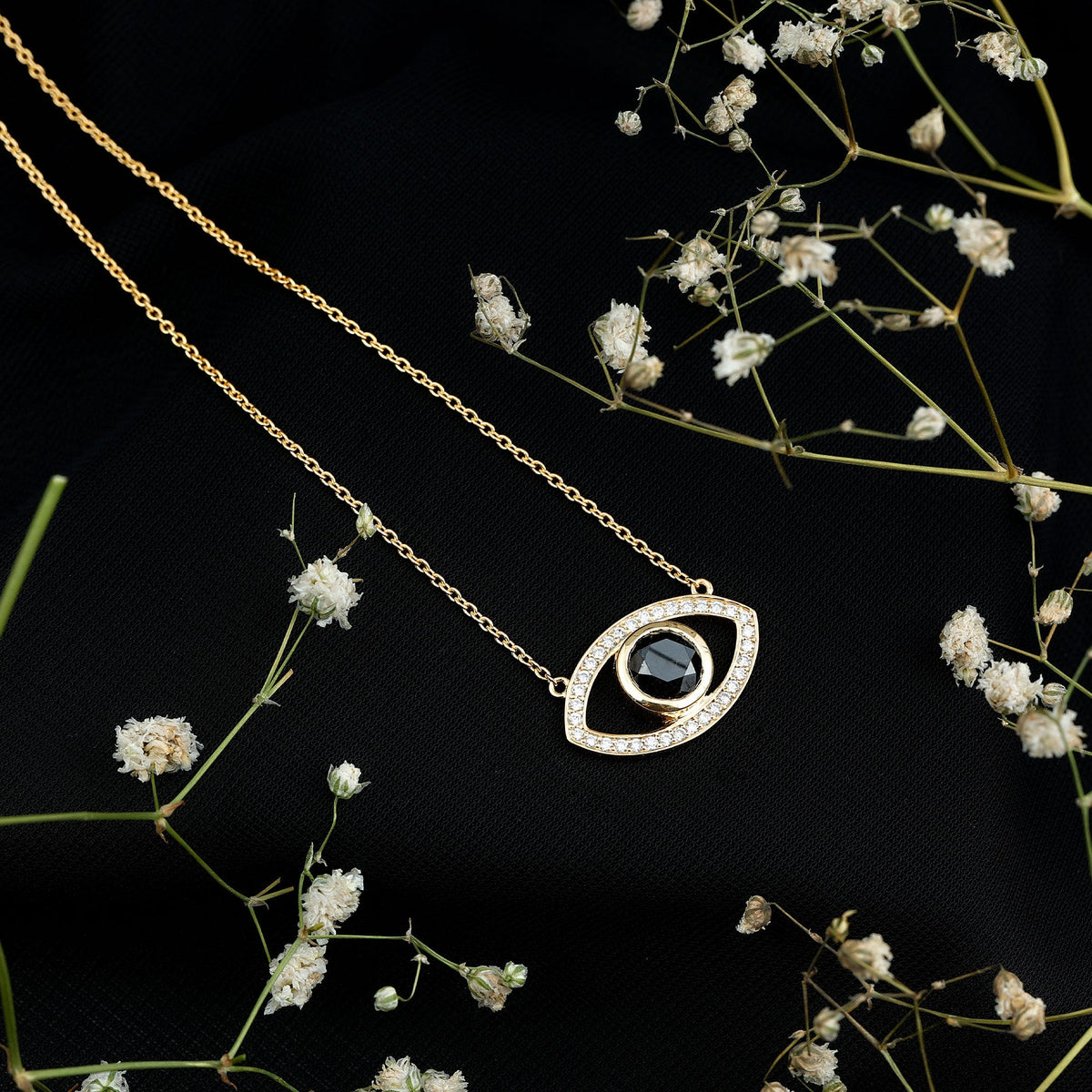 Natural 1.6 carat black diamond evil eye pendant in yellow gold plated silver, featuring a detailed evil eye design.