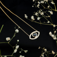 Natural 1.6 carat black diamond evil eye pendant in yellow gold plated silver, featuring a detailed evil eye design.