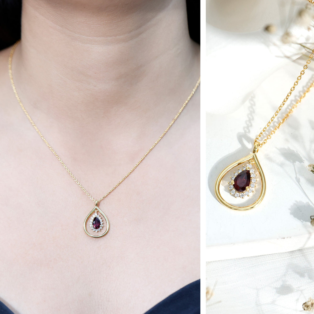 Rhodolite garnet and diamond teardrop pendant necklace with silver chain from Rosec Jewels, showcasing a sparkling gemstone design.
