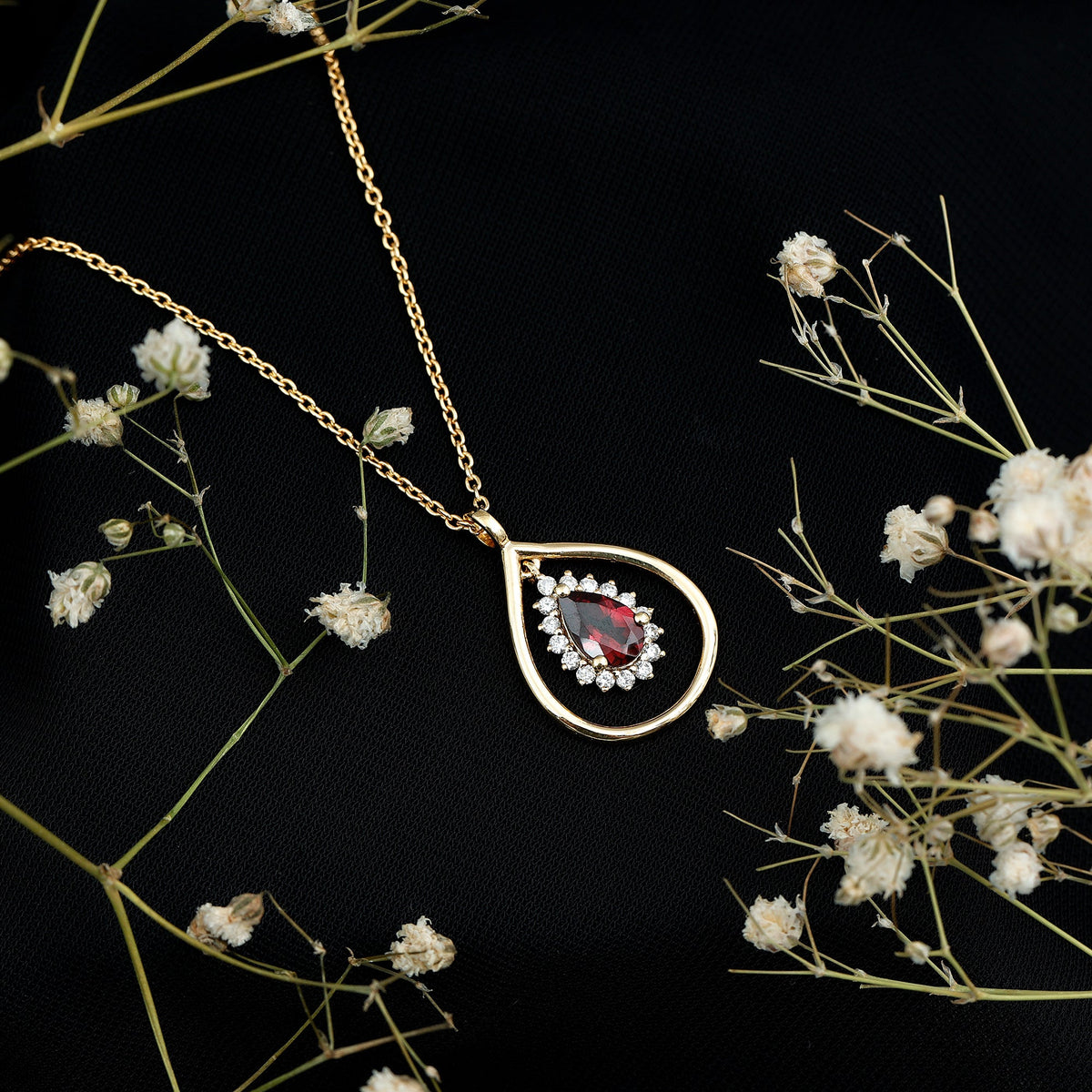 Rhodolite garnet and diamond teardrop pendant necklace with silver chain from Rosec Jewels.