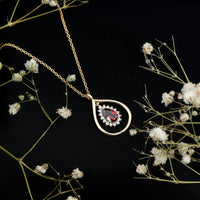 Rhodolite garnet and diamond teardrop pendant necklace with silver chain from Rosec Jewels.