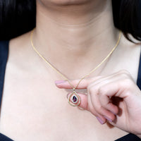 Rhodolite Garnet and diamond teardrop pendant necklace with silver chain by Rosec Jewels, featuring a sparkling gemstone and elegant design.