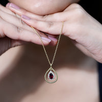 Rhodolite garnet and diamond teardrop pendant on silver chain, elegant jewelry piece from Rosec Jewels.
