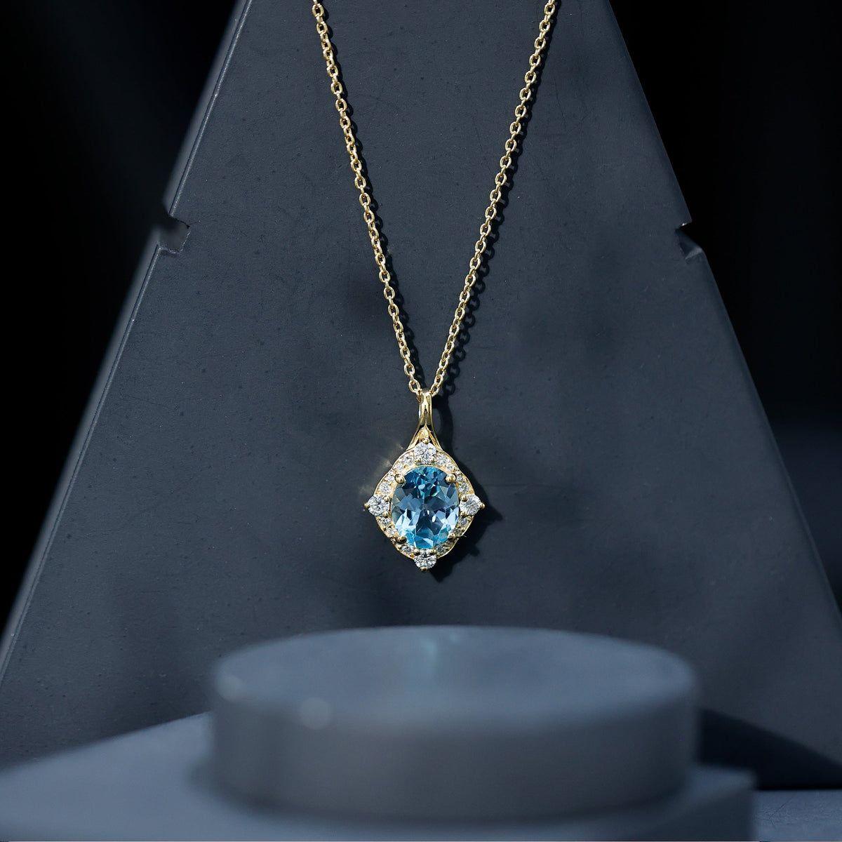 Vintage sky blue topaz pendant with diamond halo necklace by Rosec Jewels, showcasing a sparkling gemstone and elegant design.