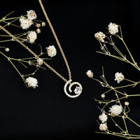 Yellow gold plated silver Morganite swirl pendant necklace with lab diamond accents, elegant jewelry piece.