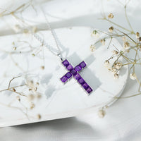 Princess cut amethyst cross pendant necklace with silver chain from Rosec Jewels, featuring a sparkling purple gemstone and elegant design.