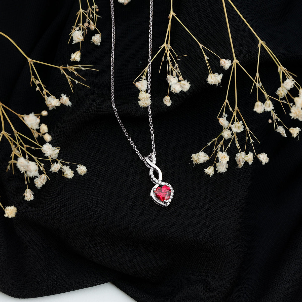 Lab grown ruby heart and infinity pendant on silver chain, 1 carat, plated with 14k yellow gold, from Rosec Jewels.