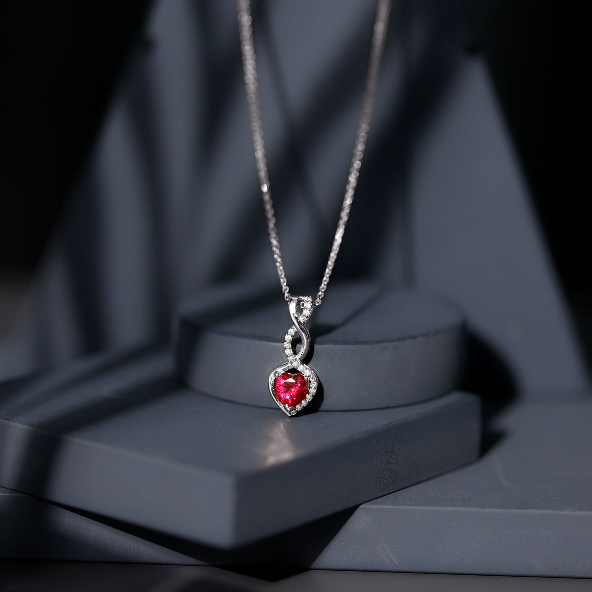 Lab grown ruby heart and infinity pendant on silver chain, 1 carat, 14k yellow gold-plated Rosec Jewels necklace.