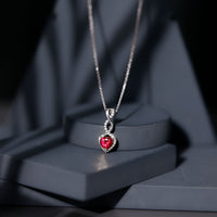 Lab grown ruby heart and infinity pendant on silver chain, 1 carat, 14k yellow gold-plated Rosec Jewels necklace.