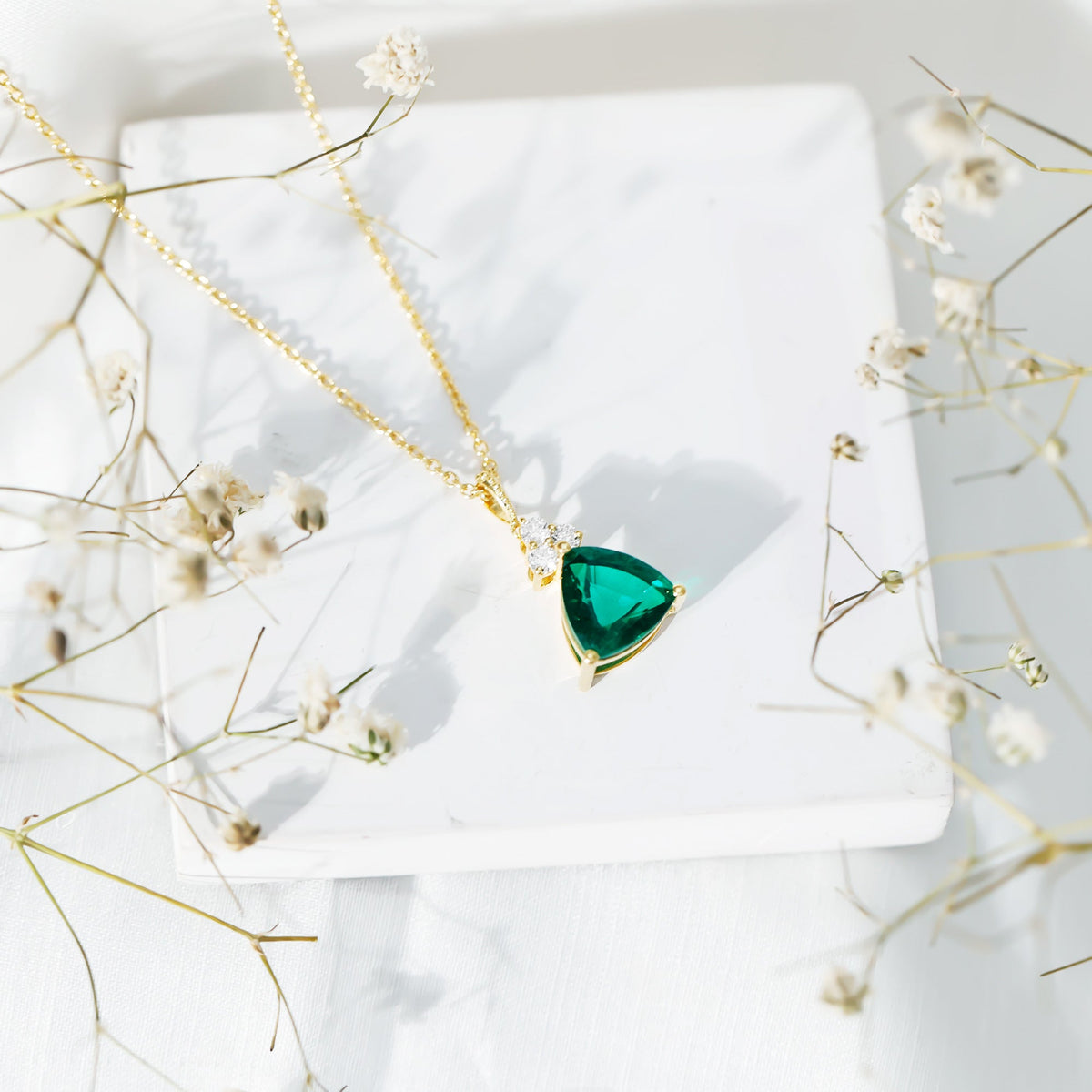 Lab-grown emerald pendant necklace with 3.5 carat trilliant cut gemstone and chain, elegant bridal jewelry by Rosec Jewels.