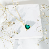 Lab-grown emerald pendant necklace with 3.5 carat trilliant cut gemstone and chain, elegant bridal jewelry by Rosec Jewels.