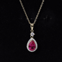 Yellow lab-created ruby teardrop pendant with moissanite halo, featuring a delicate gold chain from Rosec Jewels.