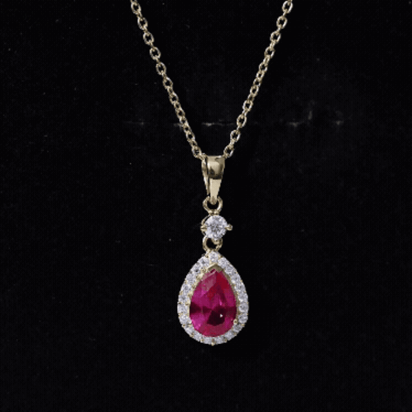 Yellow lab-created ruby teardrop pendant with moissanite halo, featuring a delicate gold chain from Rosec Jewels.