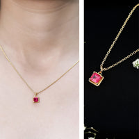 Rosec Jewels princess cut lab-created ruby solitaire pendant with rope frame, showcasing a sparkling ruby gemstone and elegant design.