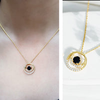 Lab-created black and white diamond circle pendant necklace with silver chain from Rosec Jewels, showcasing a elegant jewelry design.