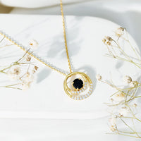 Lab created black and white diamond circle pendant on silver chain, elegant jewelry from Rosec Jewels.