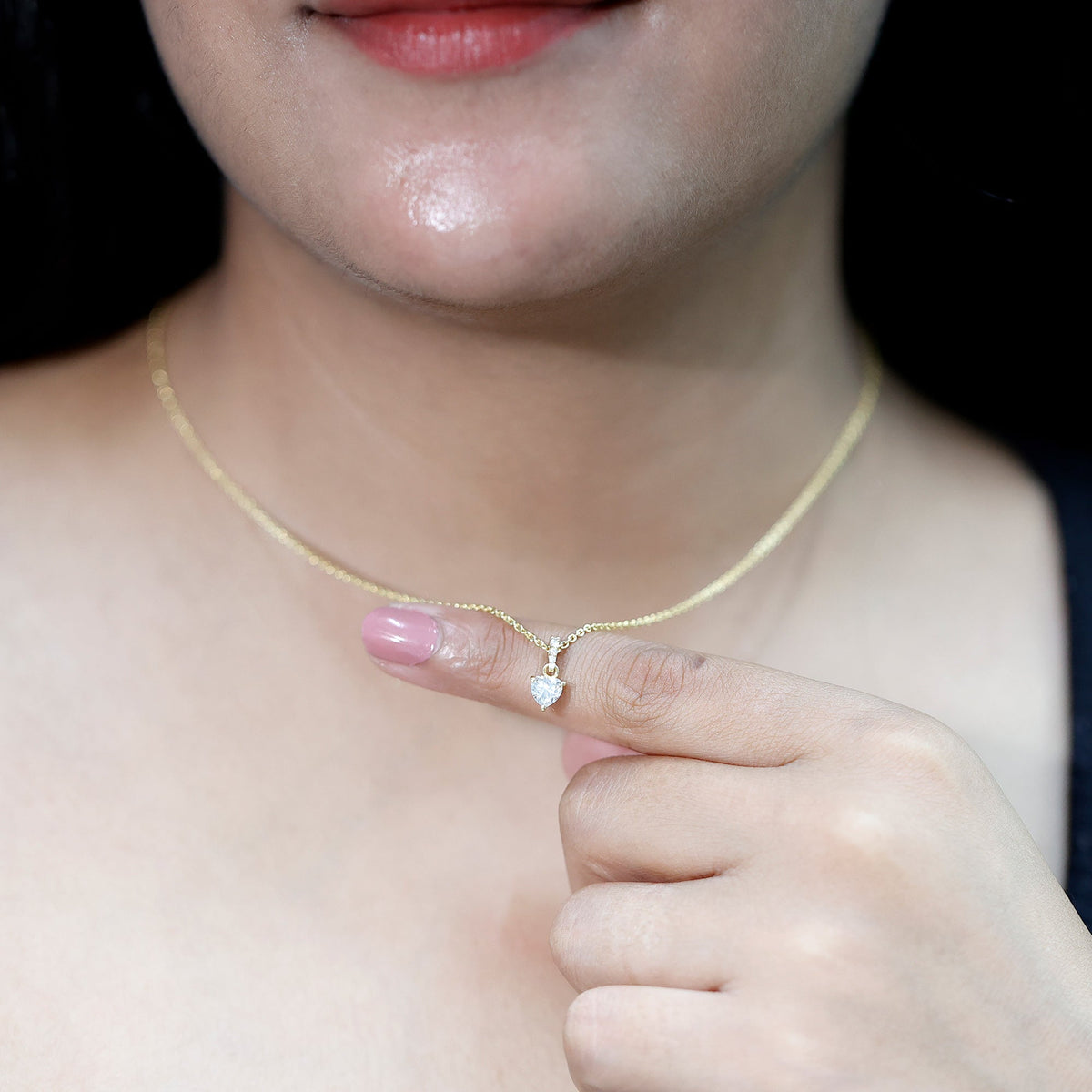 Yellow gold plated silver heart pendant with 0.5 carat moissanite, featuring a chain, from Rosec Jewels.
