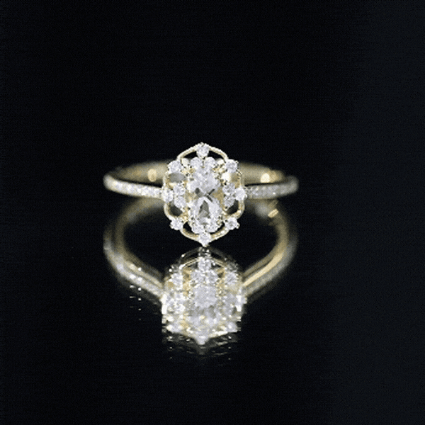 Vintage-inspired Morganite engagement ring with diamonds, featuring a yellow gold band and intricate detailing by Rosec Jewels.