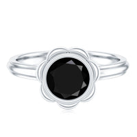 Black onyx bezel set engagement ring with silver band by Rosec Jewels, showcasing a 1.2 carat oval black gemstone.