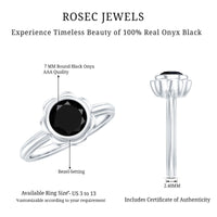Black onyx bezel set engagement ring with a 1.2 carat stone, crafted by Rosec Jewels, displayed in a close-up view.