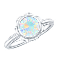 Ethiopian opal engagement ring for women with 1.5 carats set in a rose gold band, designed by Rosec Jewels.