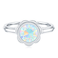 Ethiopian opal engagement ring for women featuring a 1.5 carat oval gemstone set in a silver band, by Rosec Jewels.