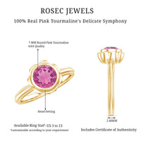 Round pink tourmaline flower engagement ring featuring a 1-carat gemstone set in a delicate ring band.