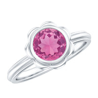 Round pink tourmaline flower engagement ring featuring a 1-carat gemstone set in a delicate ring band.