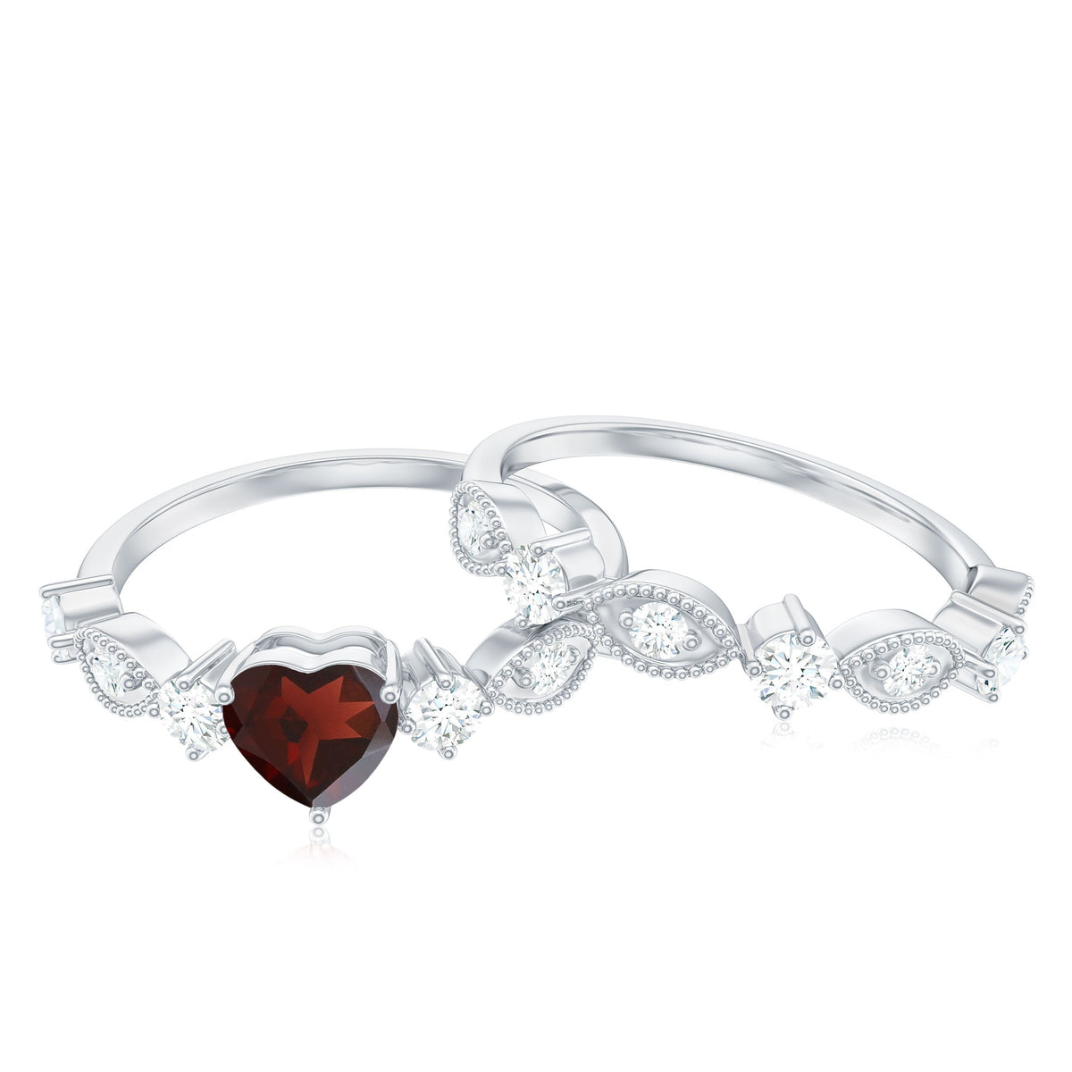 Natural garnet and diamond heart engagement ring with matching wedding band by Rosec Jewels, showcasing intricate design and sparkling stones.