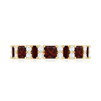 Natural red garnet half eternity ring with diamond accents from Rosec Jewels, showcasing a band of sparkling gemstones and rich red color.