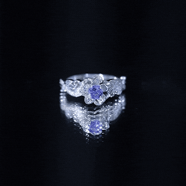 Certified Tanzanite and diamond flower engagement ring in silver featuring a floral design with sparkling stones, by Rosec Jewels.