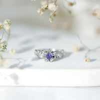 Certified Tanzanite and Diamond flower engagement ring in silver with intricate floral design, from Rosec Jewels.