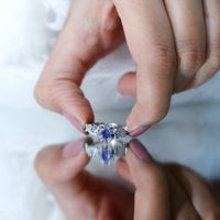 Certified Tanzanite and diamond flower engagement ring in silver with intricate floral design by Rosec Jewels.
