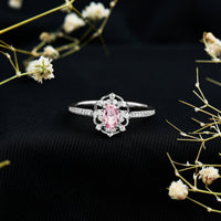 Natural pink sapphire and diamond vintage engagement ring in silver with intricate detailing by Rosec Jewels.