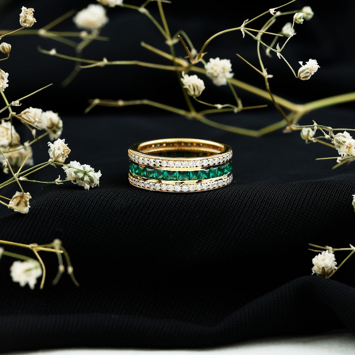 Lab grown emerald eternity wedding band with three rows of sparkling emeralds, set in a Rosec Jewels rings design.