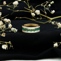 Lab grown emerald eternity wedding band with three rows of sparkling emeralds, set in a Rosec Jewels rings design.