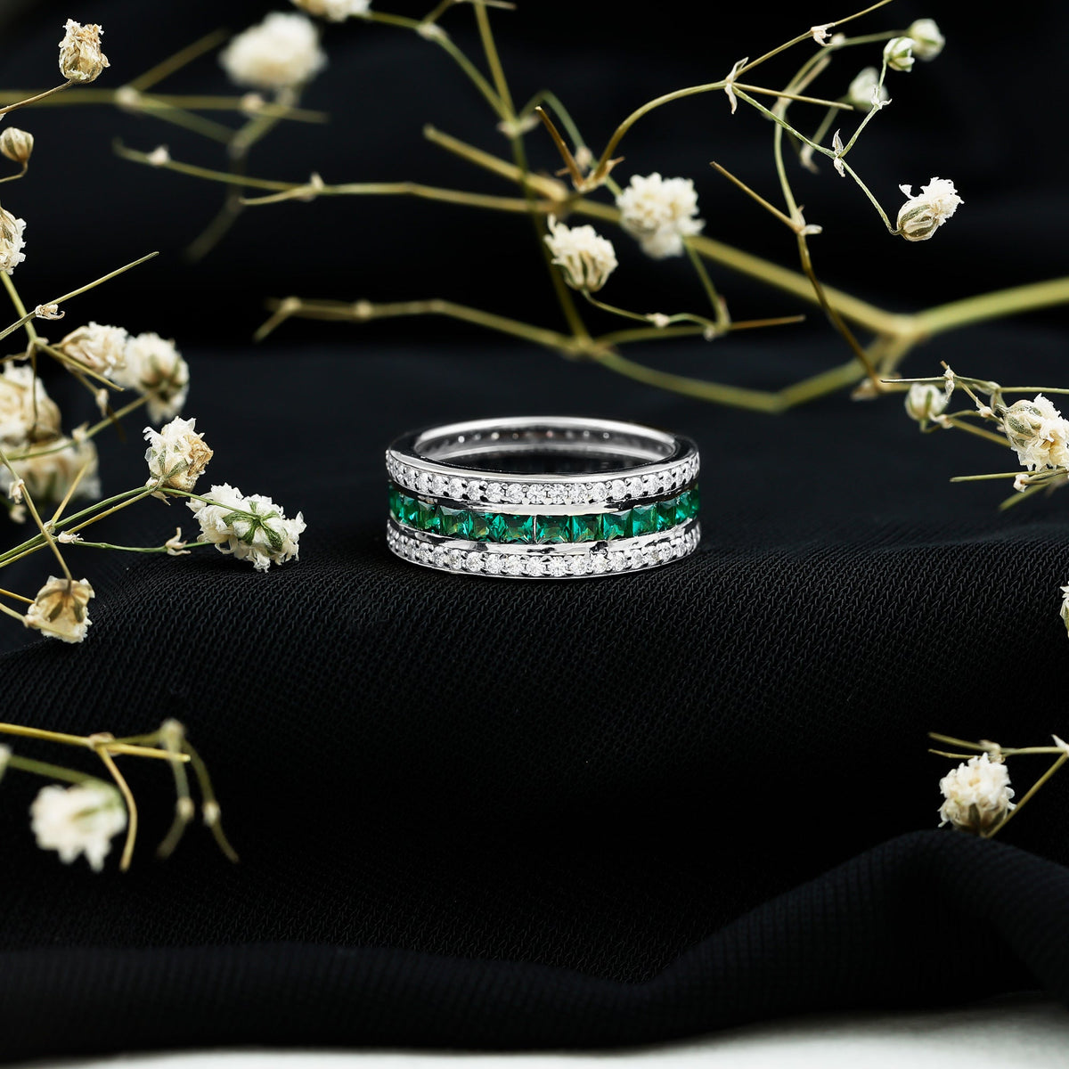 Certified lab-grown emerald 3-row eternity wedding band by Rosec Jewels, featuring sparkling green gemstones in a sleek ring design.