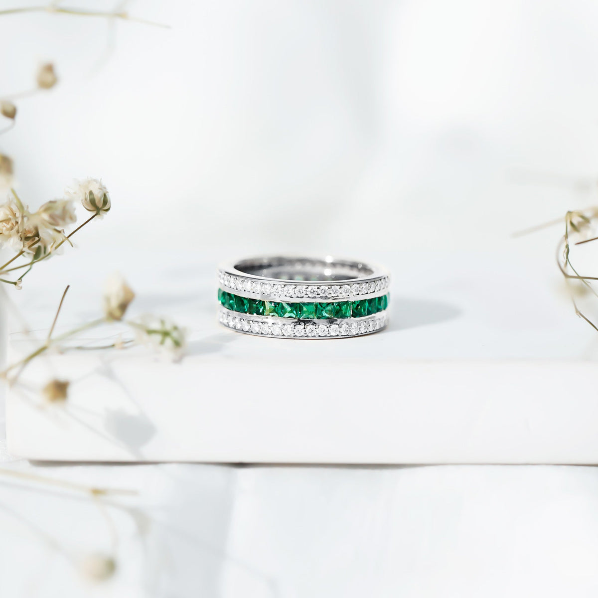 Certified lab-grown emerald 3-row eternity wedding band by Rosec Jewels featuring sparkling green gemstones and platinum setting.