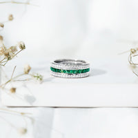 Certified lab-grown emerald 3-row eternity wedding band by Rosec Jewels featuring sparkling green gemstones and platinum setting.